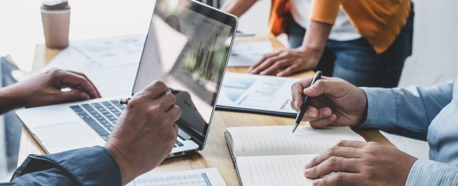 man on a laptop in a meeting